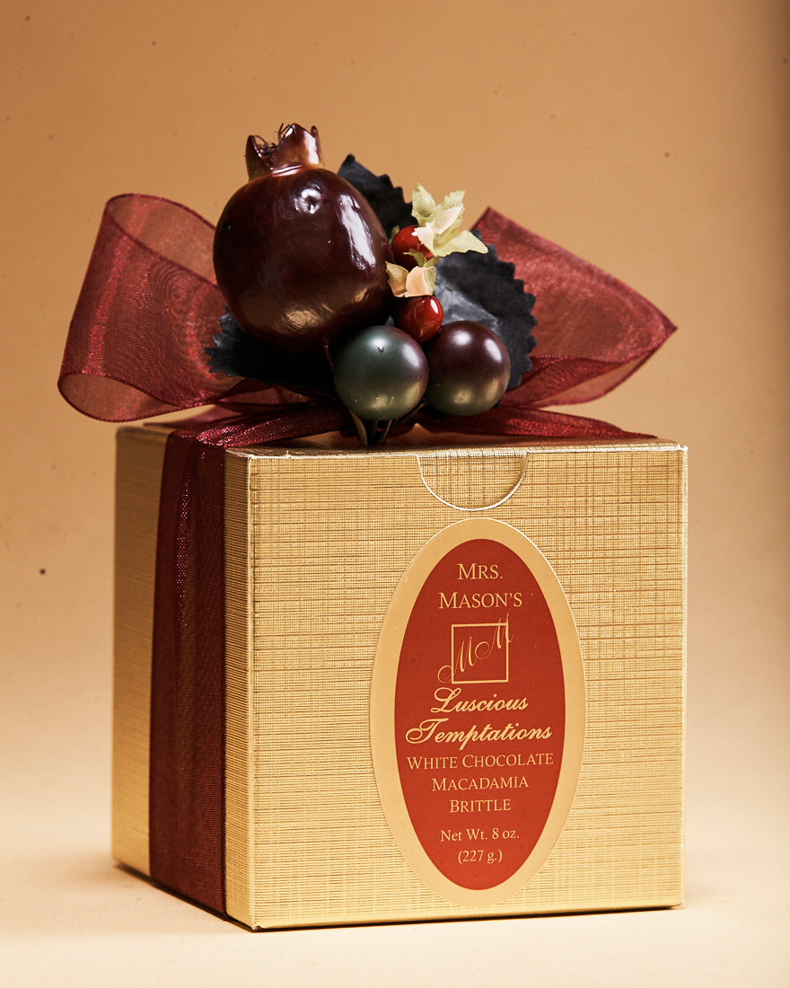 White Chocolate Macadamia Brittle in half pound gold  gift box in Fall wrap