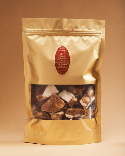 White Chocolate Macadamia Brittle in one pound gold bulk bag